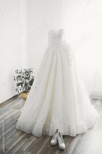 The perfect wedding dress in the room of the bride © olegparylyak