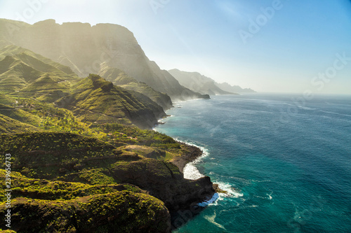Green hills and cliffs of Tamadaba Natural Park on the coast of the ocean near Agaete, Gran Canaria island, Spain photo