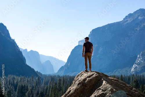 Hiker On Top of Mountain - Looking out at Vast Yosemite National Park