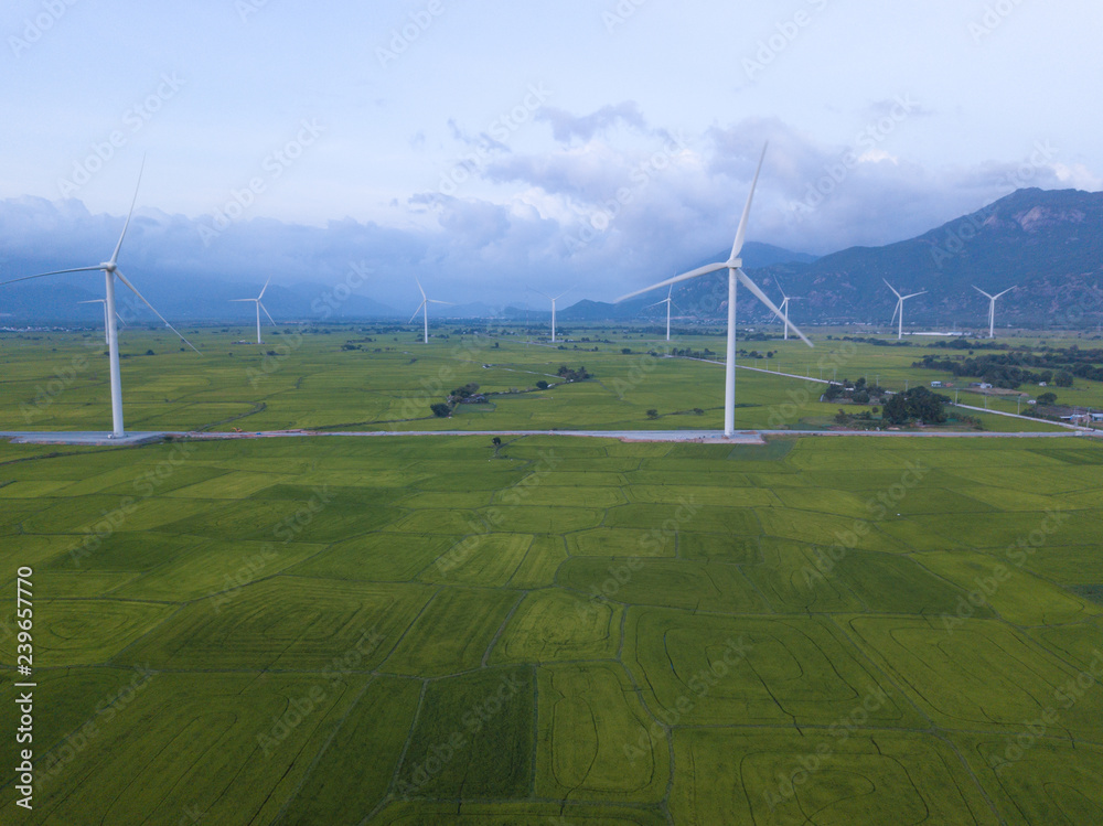 Wind turbine farm or windmill on golden sunset sky in summer day. High-quality stock photo image of wind turbine or windmill for clean energy concept. Energy Production with clean and Renewable Energy Wind turbine farm or windmill on golden sunset sky in summer day. High-quality stock photo image of wind turbine or windmill for clean energy concept. Energy Production with clean and Renewable Energy