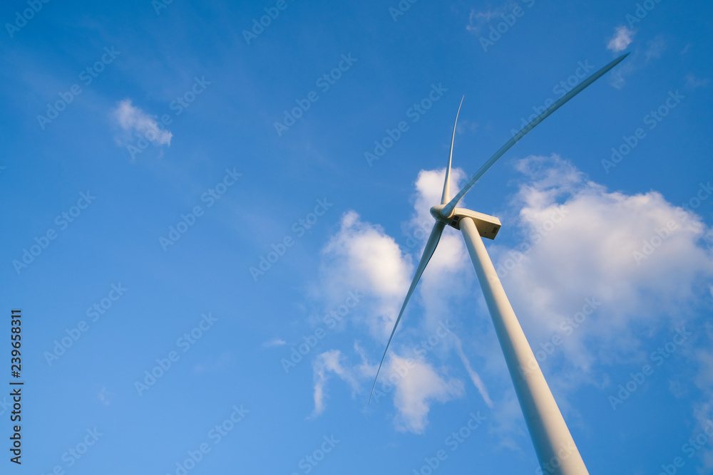 View up, bottom view of wind turbine, windmill isolated on blue sky background. Royalty high-quality free stock photo image looking up wind turbine, windmill energy converter in a blue sky background View up, bottom view of wind turbine, windmill isolated on blue sky background. Royalty high-quality free stock photo image looking up wind turbine, windmill energy converter in a blue sky background