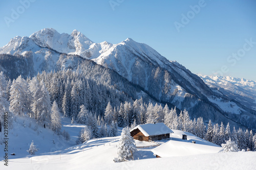 Konstfotografi Beautiful winter mountain landscape with snowcapped wooden hut