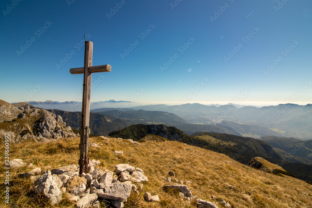 cross at the top of the mountain in the morning