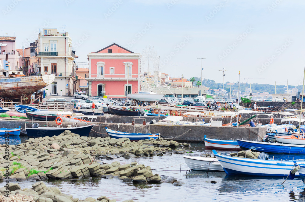 Acitrezza port with fisher boats next to Cyclops islands, Catania, Sicily, beautiful seafront