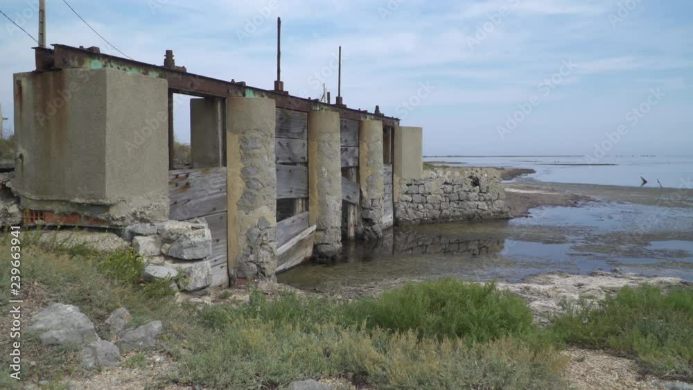 Old lock at a barrage in lagoon in southern France, Gruissan, Mediterranean Old lock at a barrage in lagoon in southern France, Gruissan, Mediterranean