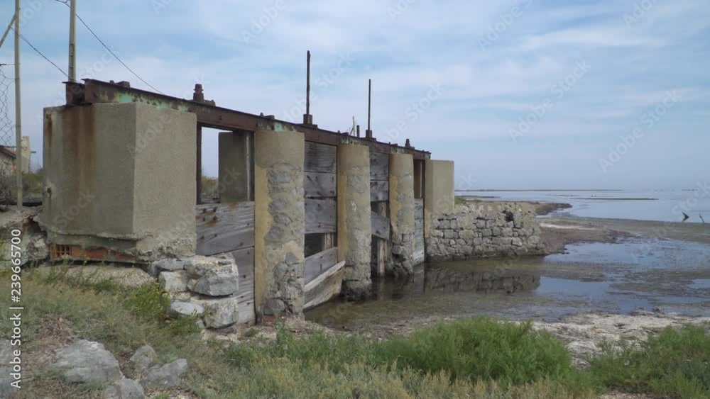 Old lock at a barrage in lagoon in southern France, Gruissan, Mediterranean Old lock at a barrage in lagoon in southern France, Gruissan, Mediterranean