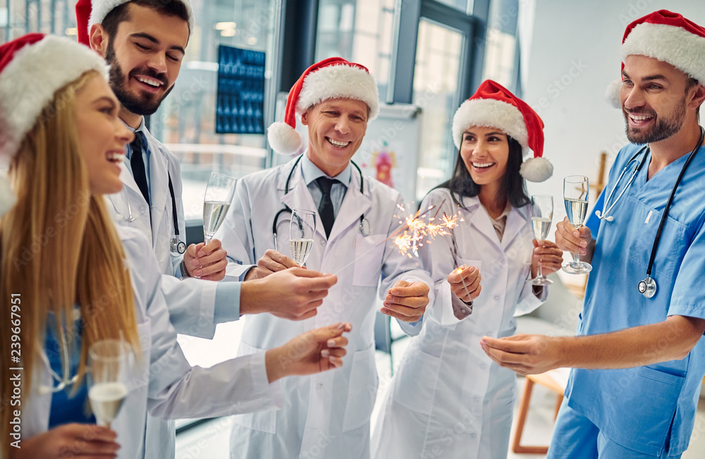 Group of doctors celebrating Christmas Group of doctors celebrating Christmas