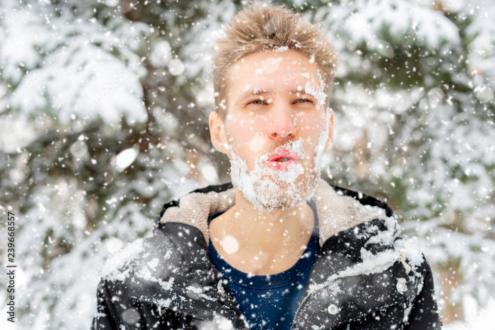 crazy mad bearded man frost face covered by snow, emotional face portrait, winter season f