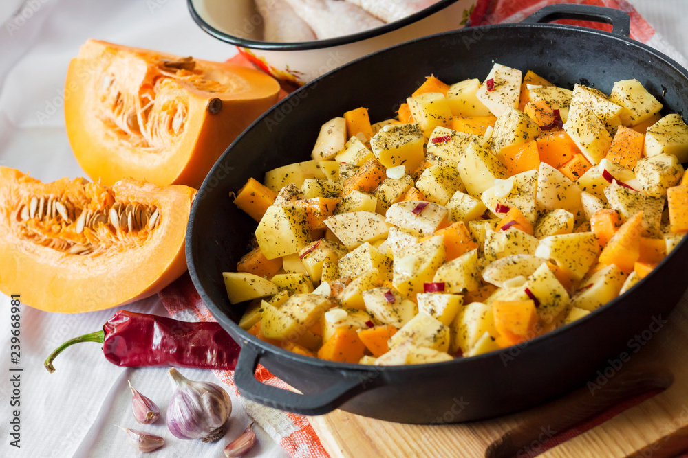 Cooking one-pot meal - chicken thighs and legs with potatoes and