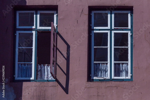 old windows in purple building