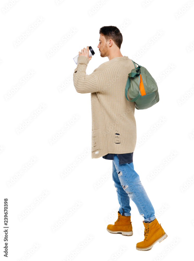 back view of walking man with coffee cup and green bag. back view of walking man with coffee cup and green bag.