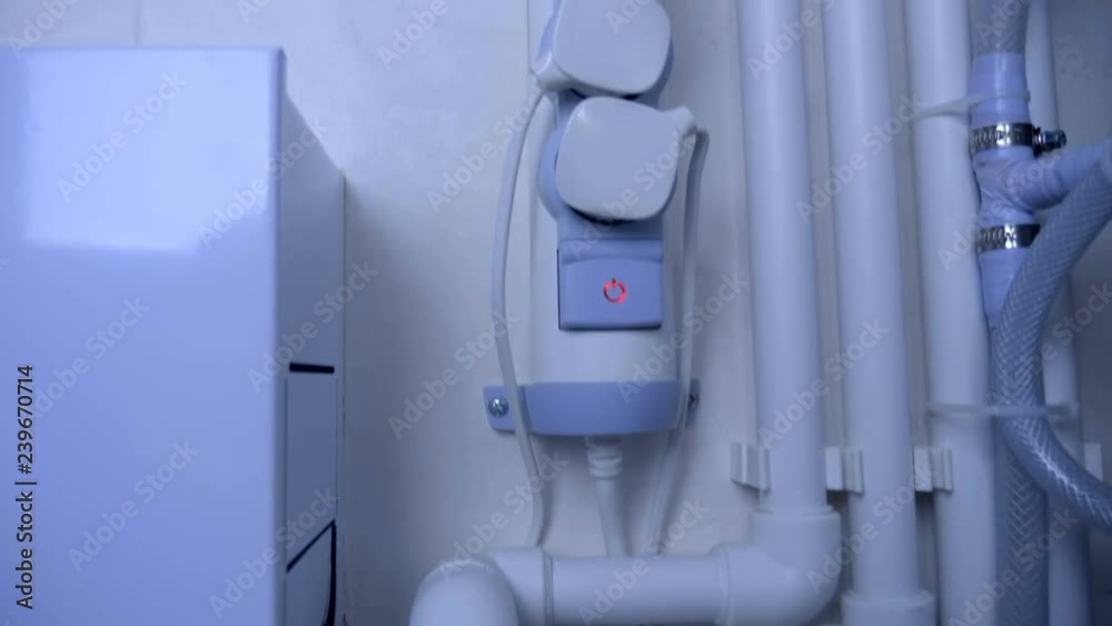 A doublecircuit gas boiler with a lot of white pipes provides residents with warm water and for