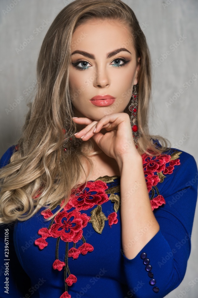 Beautiful young woman with bright makeup.