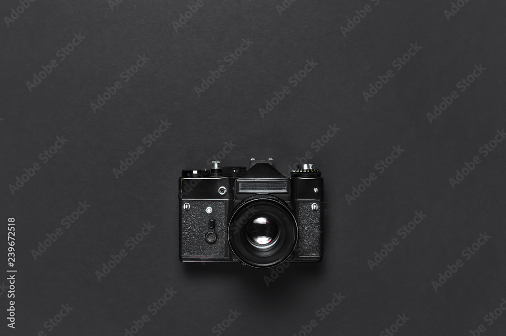 Old retro vintage camera on black background top view flat lay with copy space. Concept for the photographer, old photographic equipment, minimalistic style selective focus - obrazy, fototapety, plakaty 
