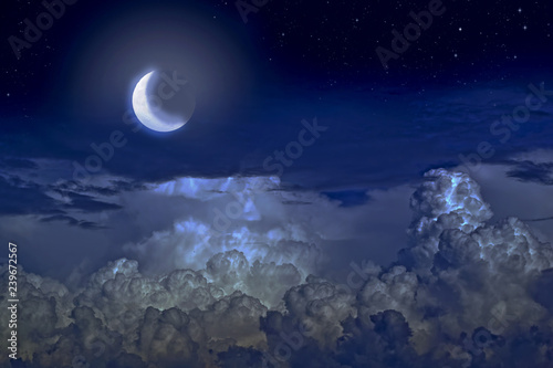 Stars, moon and cumulonimbus in the night sky