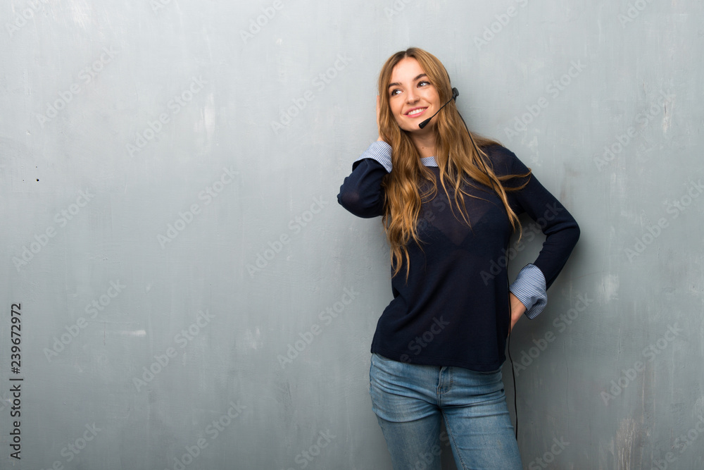Telemarketer woman thinking an idea while scratching head Telemarketer woman thinking an idea while scratching head