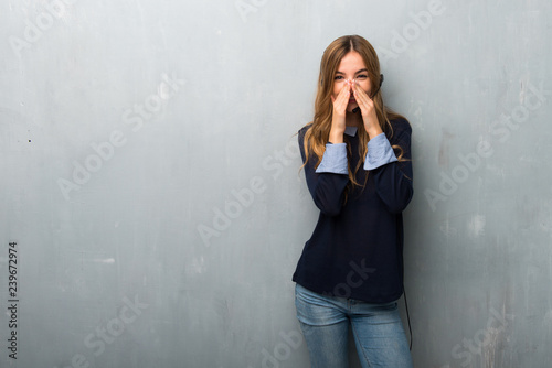 Telemarketer woman smiling a lot while covering mouth