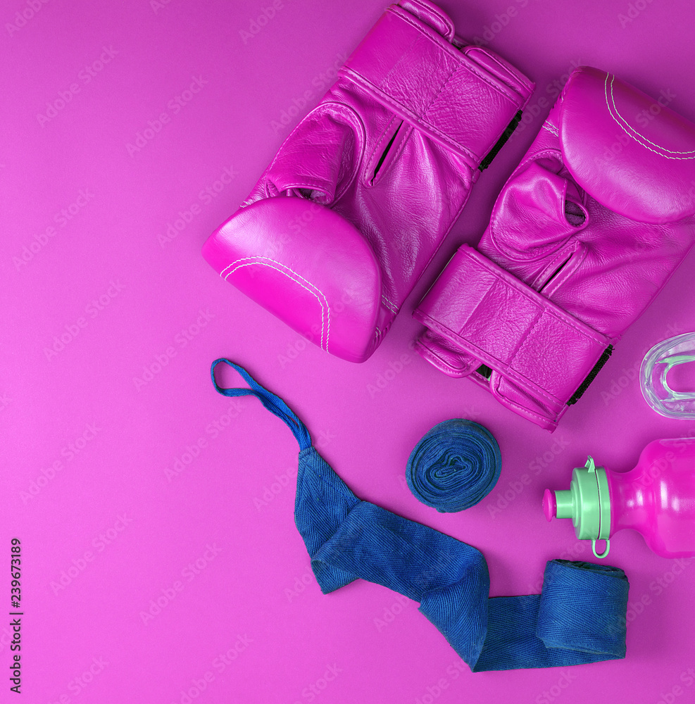 Fototapeta leather pink boxing gloves, a blue textile bandage