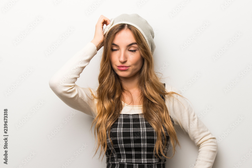Fashionably woman wearing hat with an expression of frustration and not understanding Fashionably woman wearing hat with an expression of frustration and not understanding