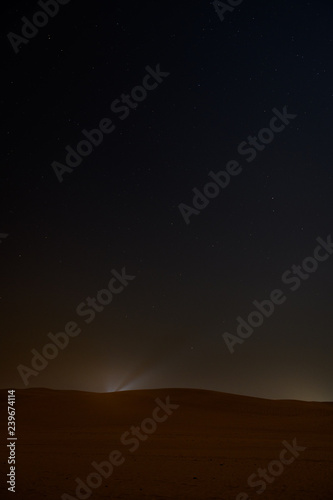 Night sky with stars above arabian desert