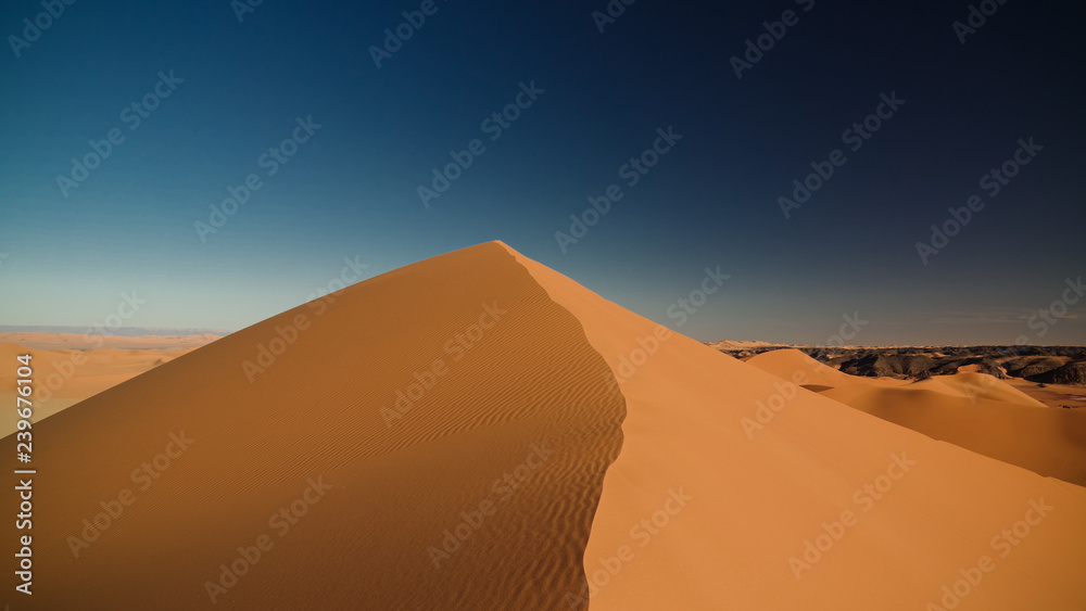 Sunset view to Tin Merzouga dune at Tassili nAjjer national park in Algeria