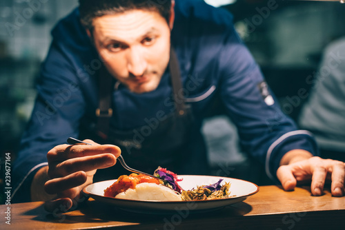Chef putting delectable dish on plate