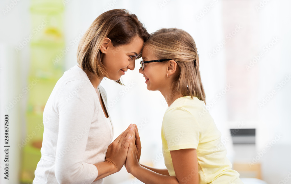 family, generation and people concept - happy smiling mother and daughter looking at each other at home family, generation and people concept - happy smiling mother and daughter looking at each other at home