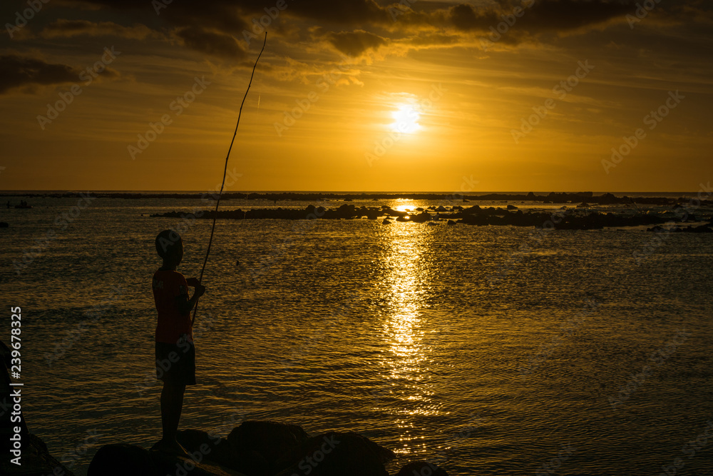 Pêche au soleil couchant