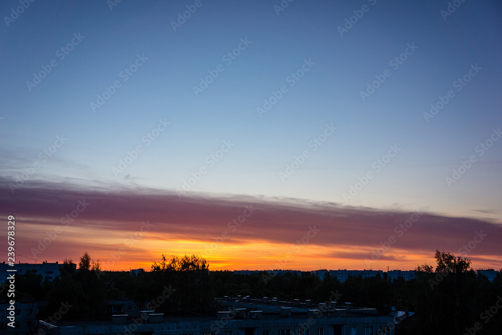 high contrast clouds on blue sky over natural landscape