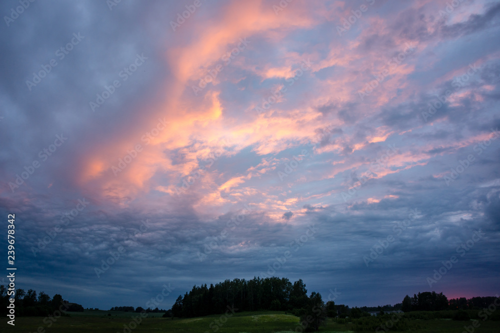 Fototapeta premium high contrast clouds on blue sky over natural landscape