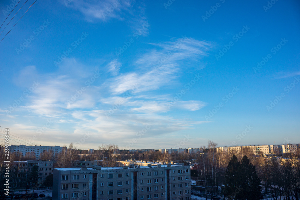 high contrast clouds on blue sky over natural landscape