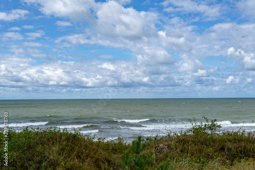 high contrast clouds on blue sky over natural landscape