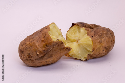 potato baked in the peel on a white background