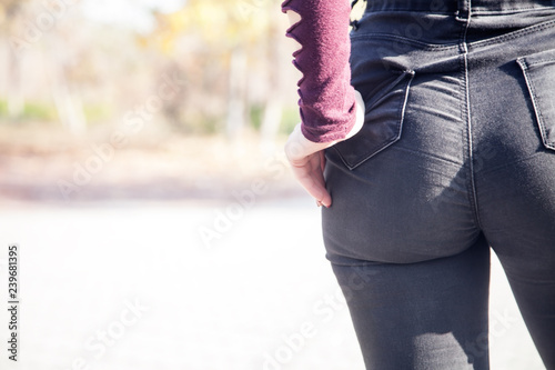 Hand in jeans pocket. Female buttocks in outdoor. Ass in black jeans.  Fashion Stock Photo | Adobe Stock