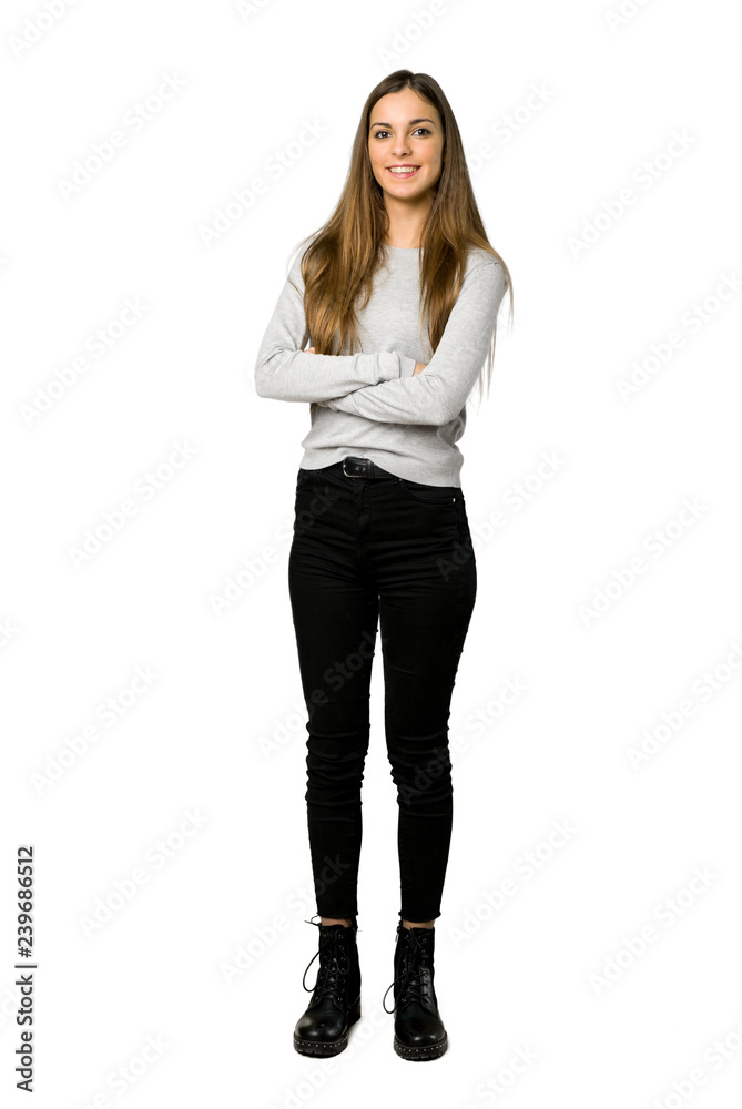 Full-length shot of young girl keeping the arms crossed in frontal position on isolated white background - obrazy, fototapety, plakaty 