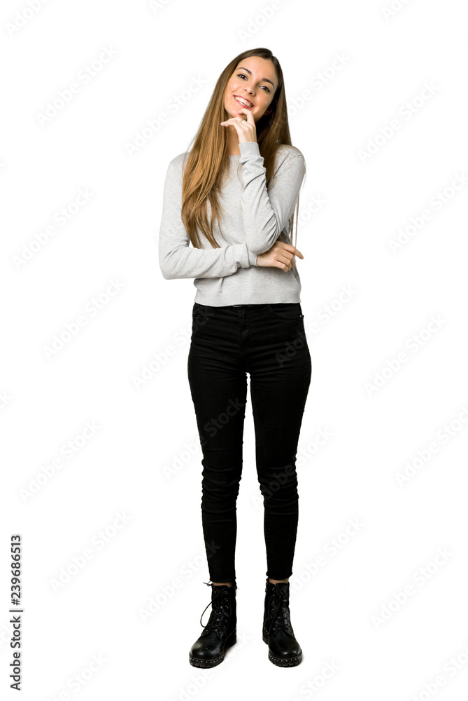 Full-length shot of young girl smiling with a sweet expression on isolated white background Full-length shot of young girl smiling with a sweet expression on isolated white background
