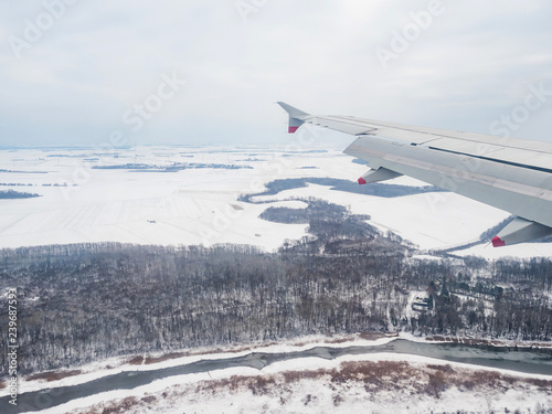 Landing a transport plane over Austria's winter landscape near Vienna.