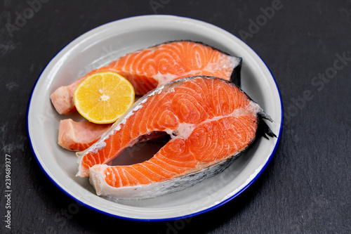 raw salmon with lemon on dish