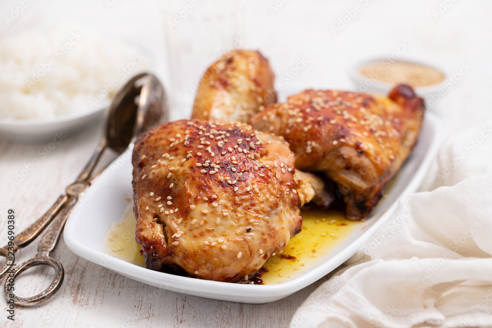 fried chicken with sauce and sesame on white dish fried chicken with sauce and sesame on white dish