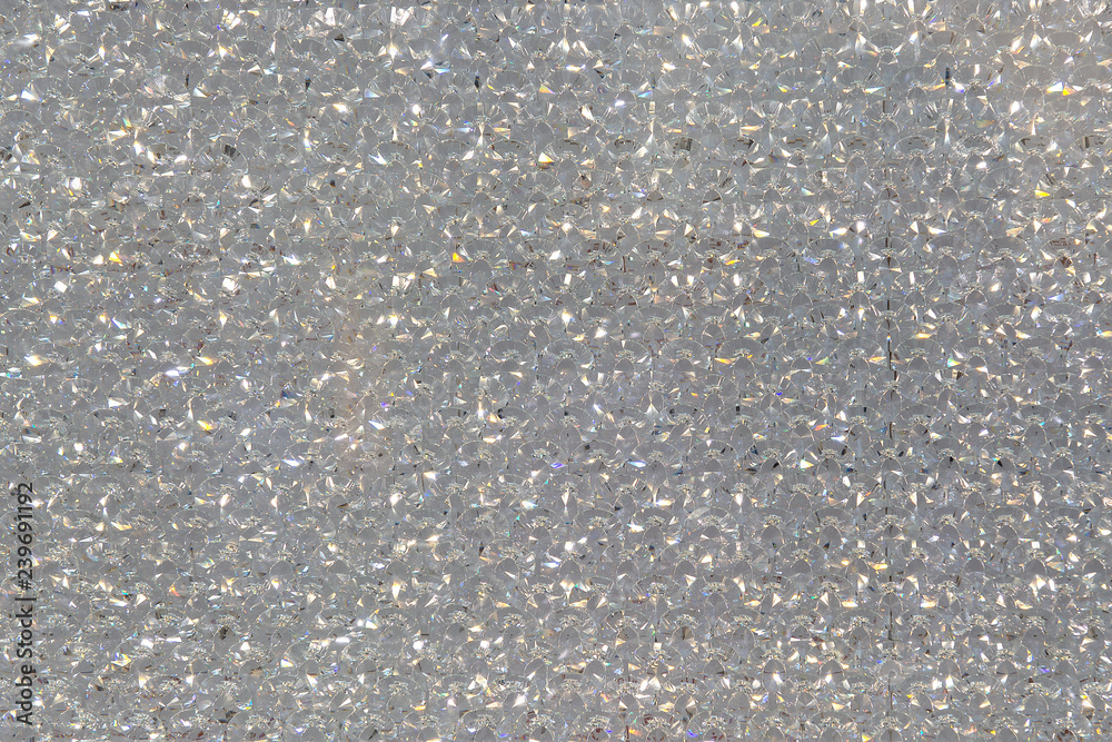 Luxury surface of shiny diamond gems. Beautiful background texture. Small brilliants texture.