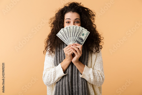 Quadro su tela Cheerful young woman wearing winter scarf