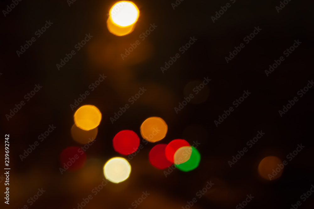 Fototapeta premium Blurred night background of city street road with bokeh effect. Abstract wallpaper for design and editing images.