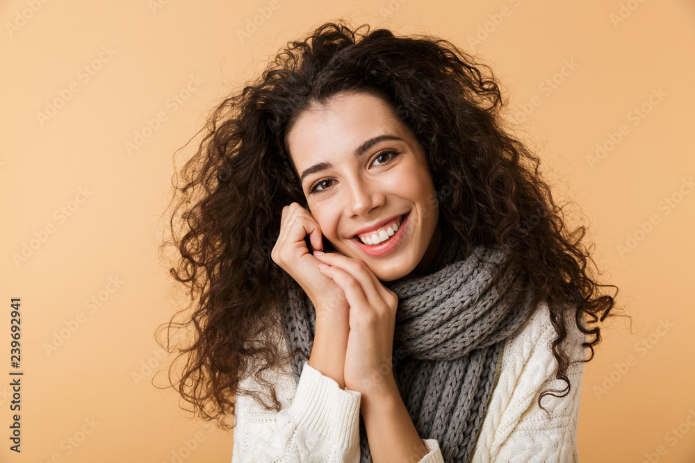 Cheerful young woman wearing winter scarf Cheerful young woman wearing winter scarf