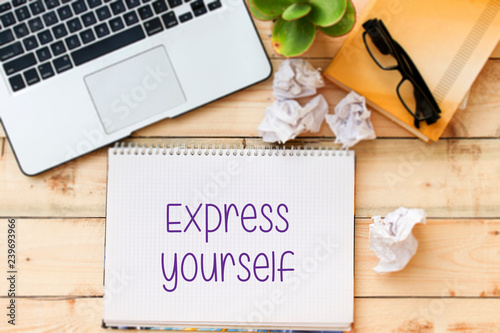 Express yourself inspiraitonal writing on notebook photo