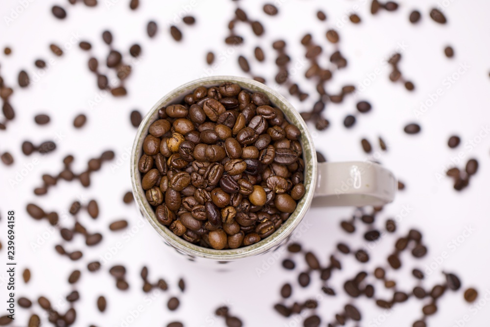 Coffee beans in cup white background Coffee beans in cup white background