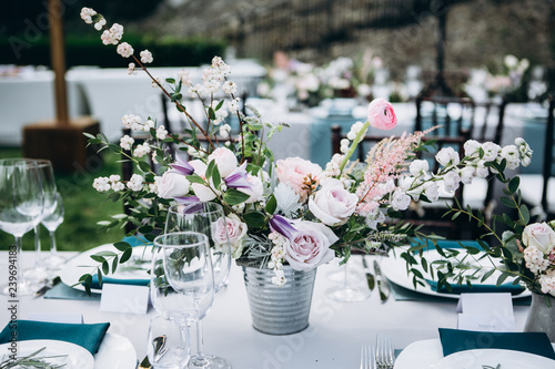 Wedding table decoration in rustic style. Wedding flowers.