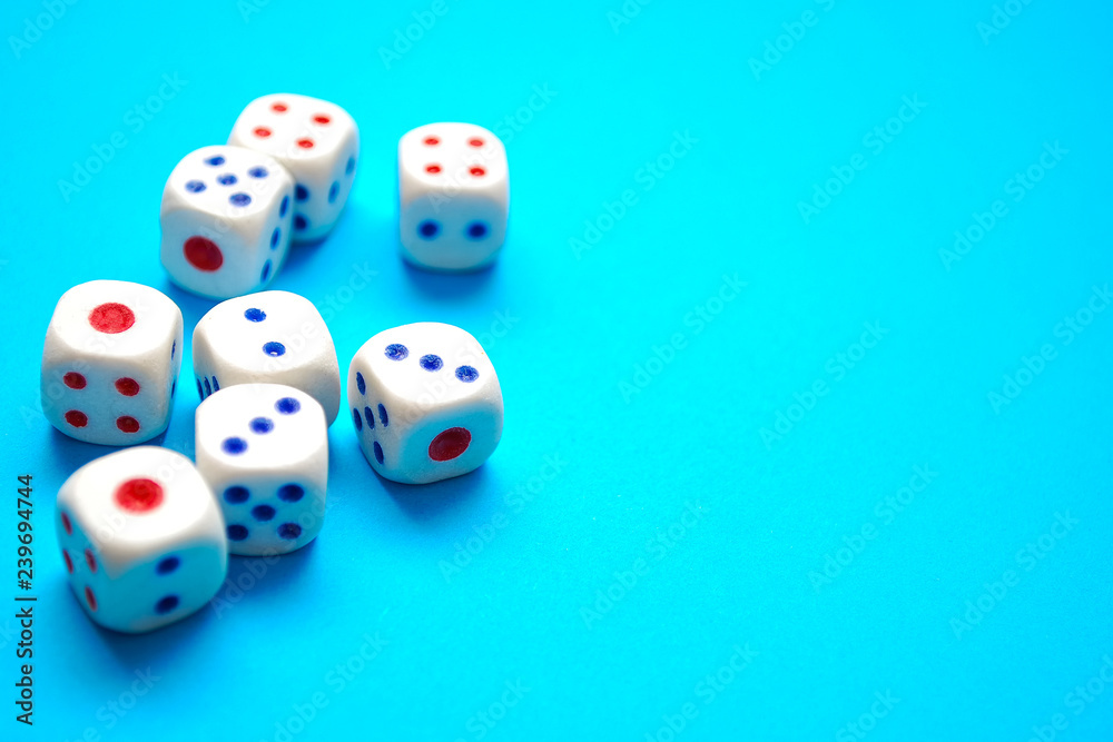 White dices on blue background. Selective focus White dices on blue background. Selective focus