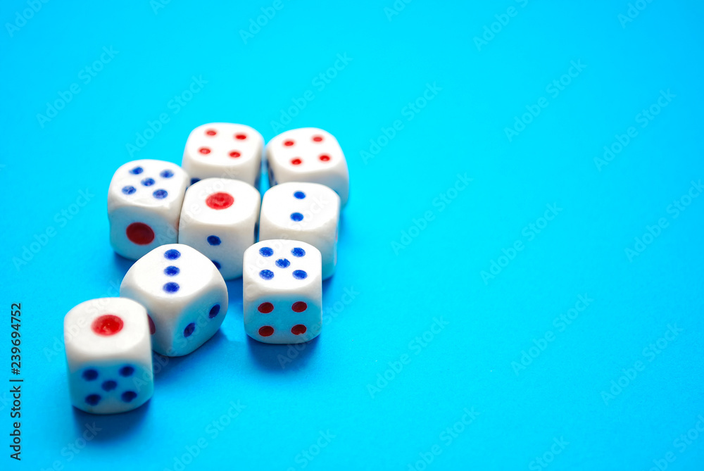 White dices on blue background. Selective focus White dices on blue background. Selective focus