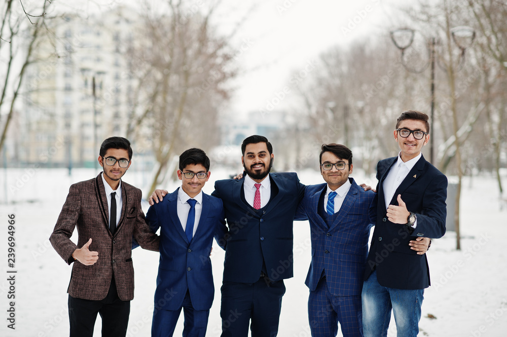 Group of five indian businessman in suits posed outdoor in winter day at Europe. Group of five indian businessman in suits posed outdoor in winter day at Europe.