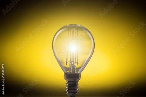 Silhouette led lamp a yellow background.